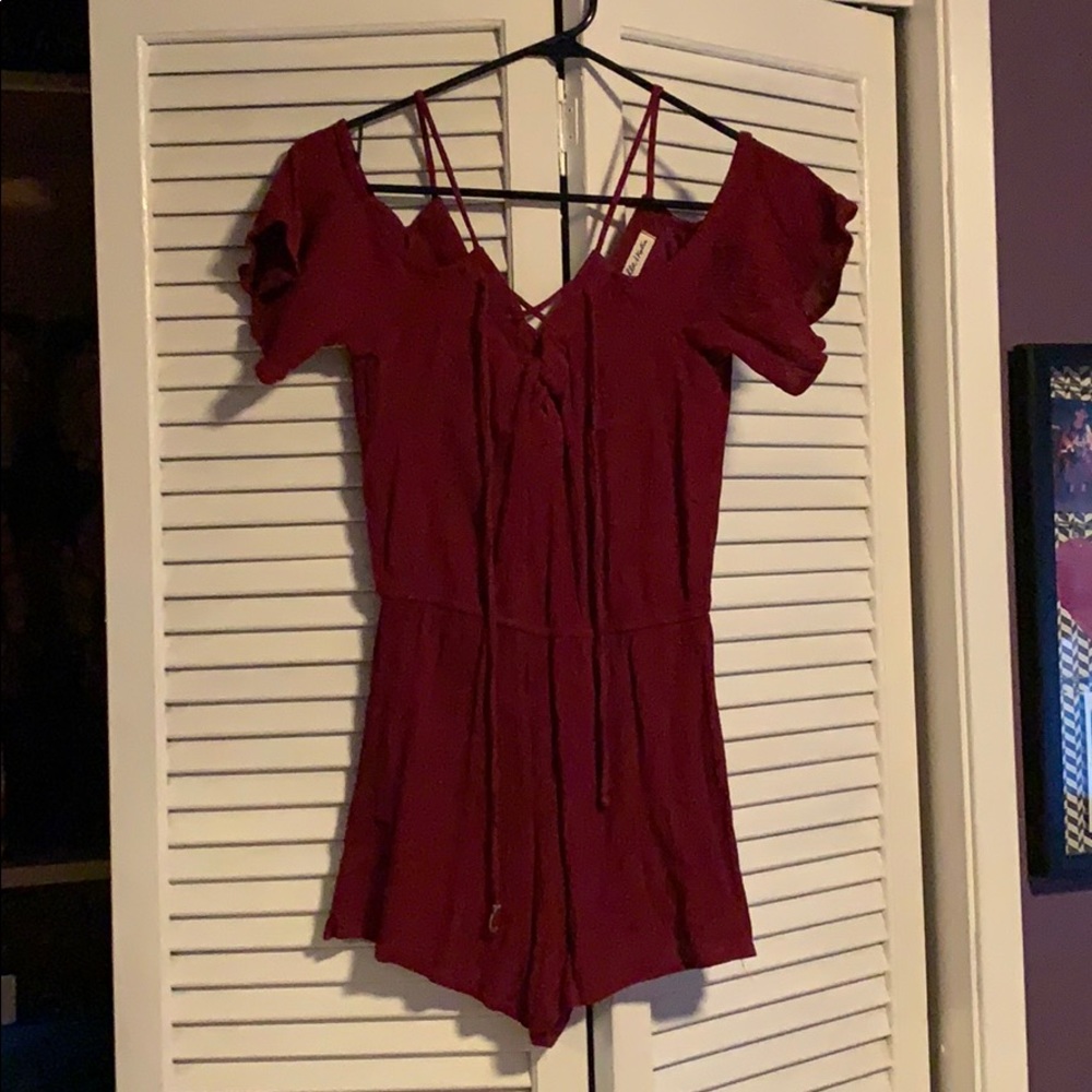 Stylish cold shoulder romper! With lace up detail